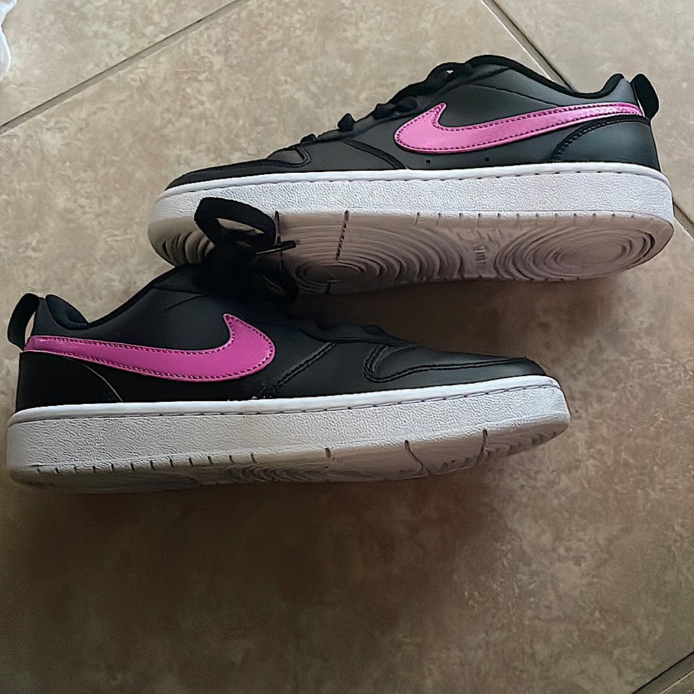 Black and purple nike shoes